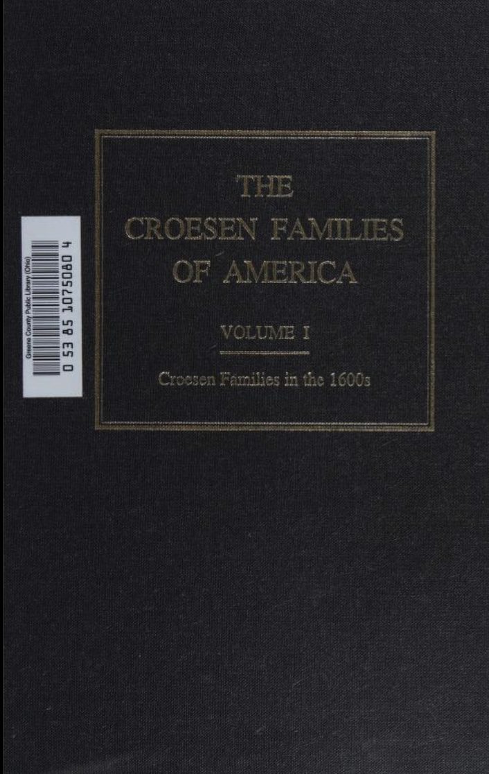 The front board of a dark cloth-bound book, blocked in gilt within a double rule: THE CROESEN FAMILIES OF AMERICA, VOLUME I, and beneath a short rule, Croesen Families in the 1600s. A library barcode label is stuck to the upper left corner.
